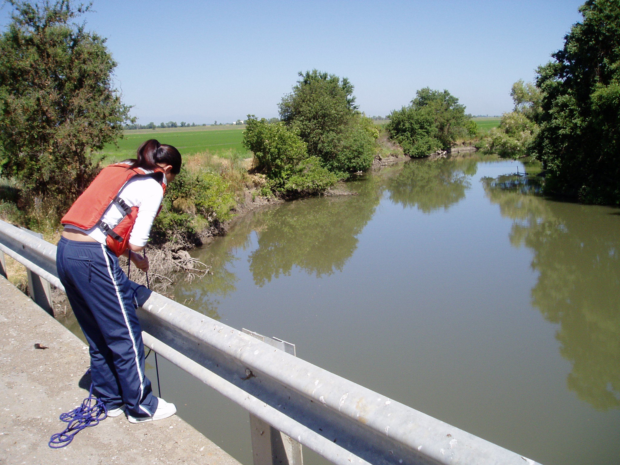 USGS scientist taking a measurement from Butte Creek