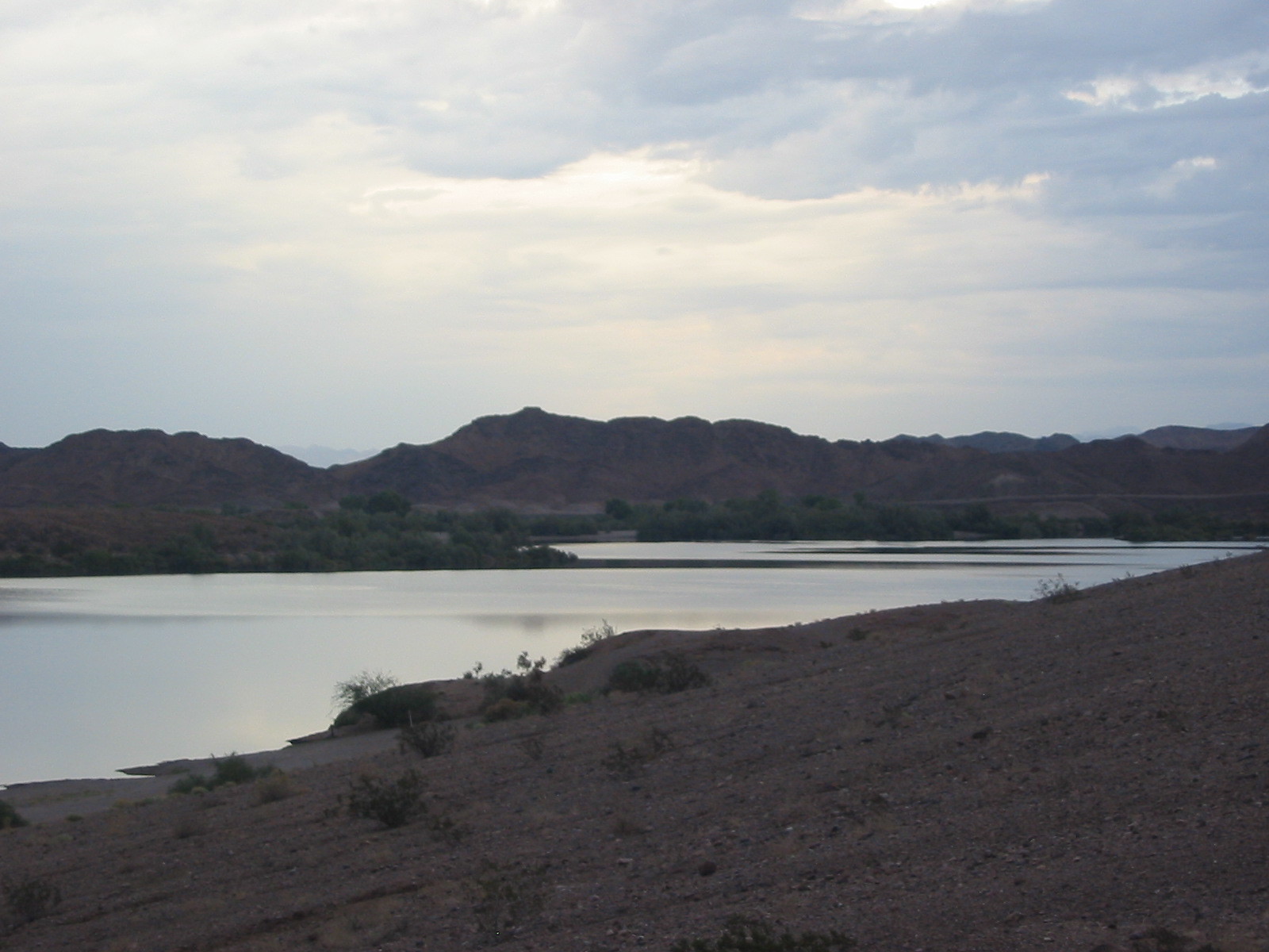 Colorado River with desert hills in the background