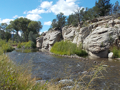 Pecos River flowing next to limestone outcrops