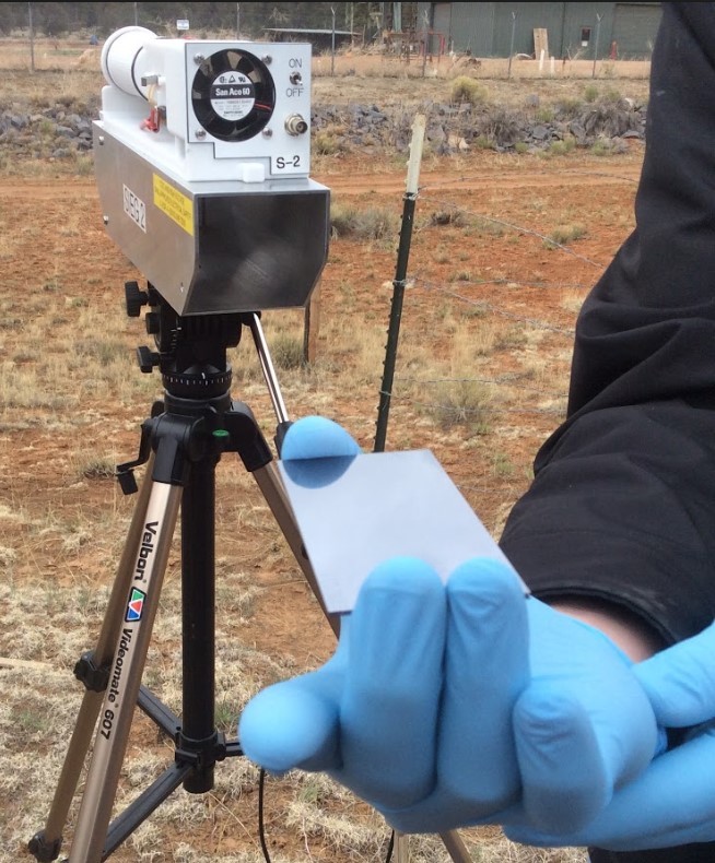  Dust particle sampler on tripod and plate used to collect particles 